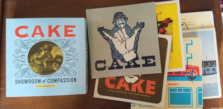 Cake - Showroom of Compassion 7" Boxset Signed - Locked Groove Records
